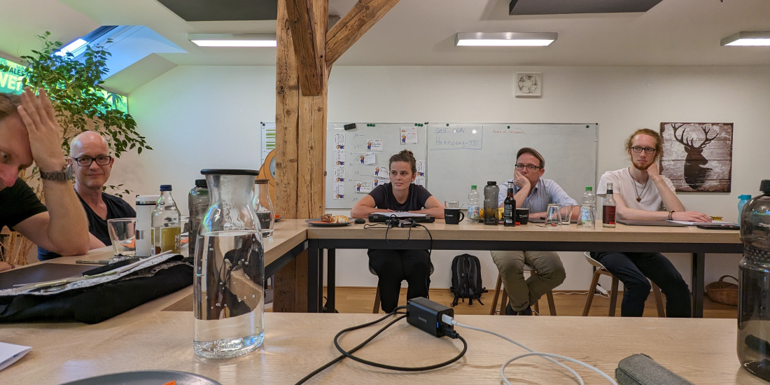 A group of people sitting in a room.