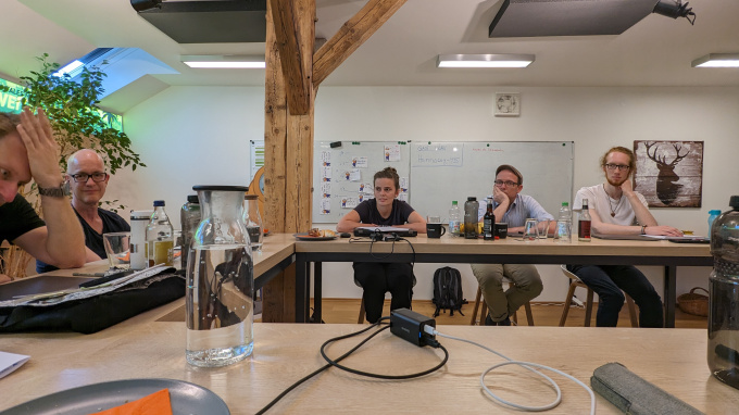 A group of people sitting in a room.